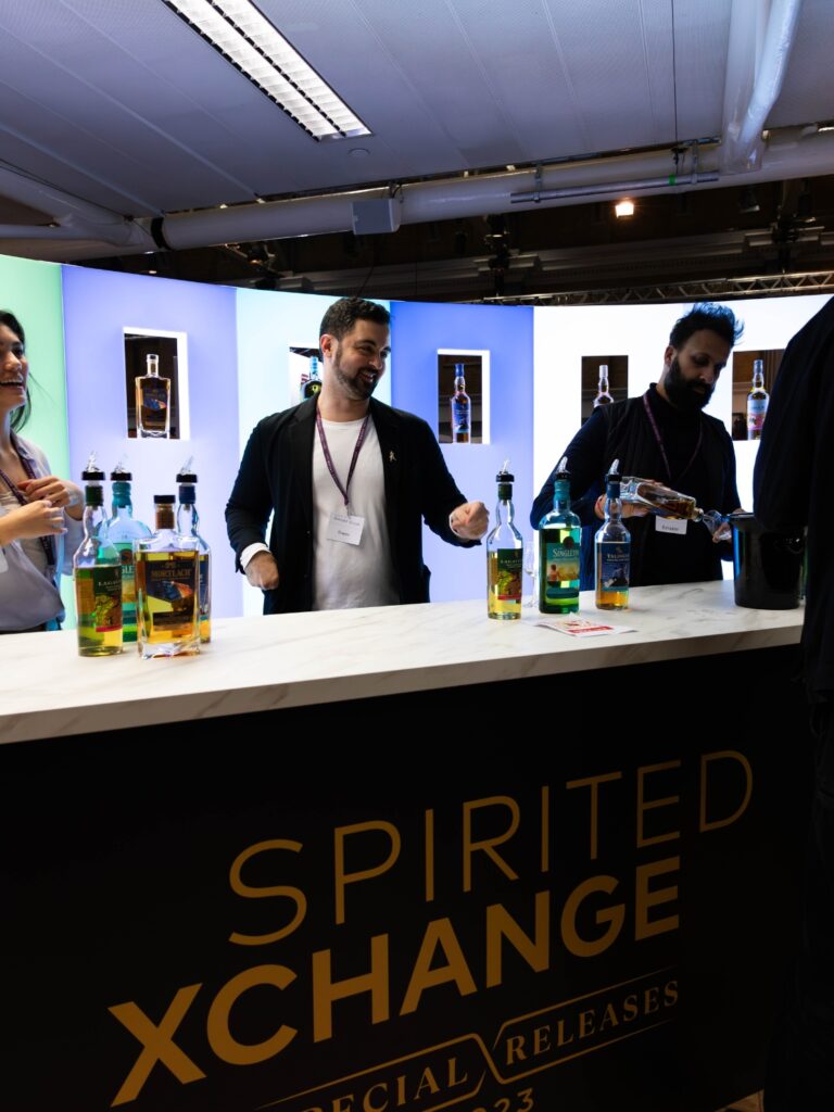 Diageo bar in action at Whisky Trade Show with our fabricated whisky wall in the background.